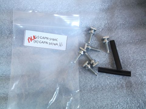 2005 Ford F-150 - A bag contains hardware parts labeled GAPN 5190C and GAPN 5074A, alongside loose bolts and black spacers.