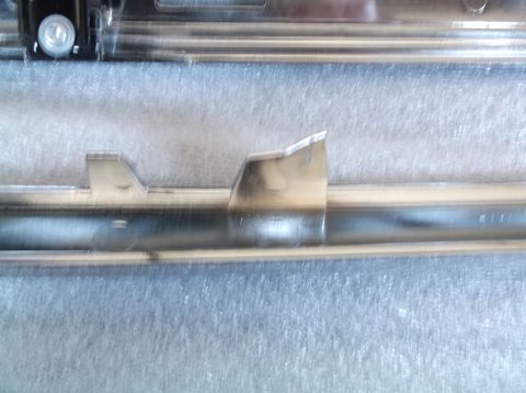 2005 Ford F-150 - Chrome trim piece with mounting tab, possibly from a vehicle.
