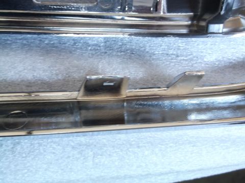 2005 Ford F-150 - A close-up view of a chrome trim piece, possibly for a vehicle's exterior.