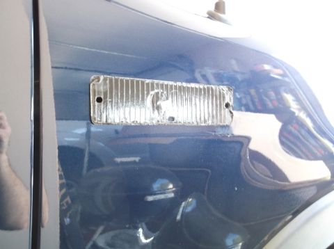 2005 Ford F-150 - Close-up of a blue truck's side marker light assembly.