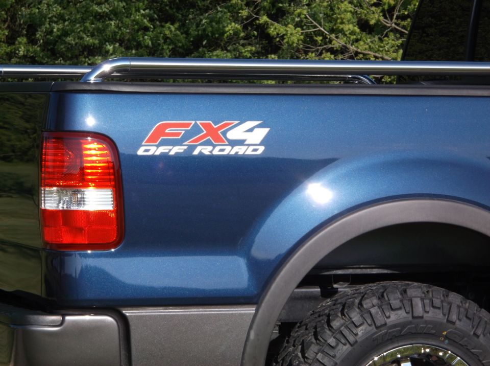 Blue 2005 Ford F-150 FX4 OFF ROAD decal on rear quarter panel