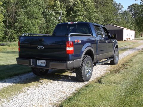 2005 Ford F-150 - This Ford F-150 pickup truck is seen from a rear three-quarter angle on a gravel driveway.