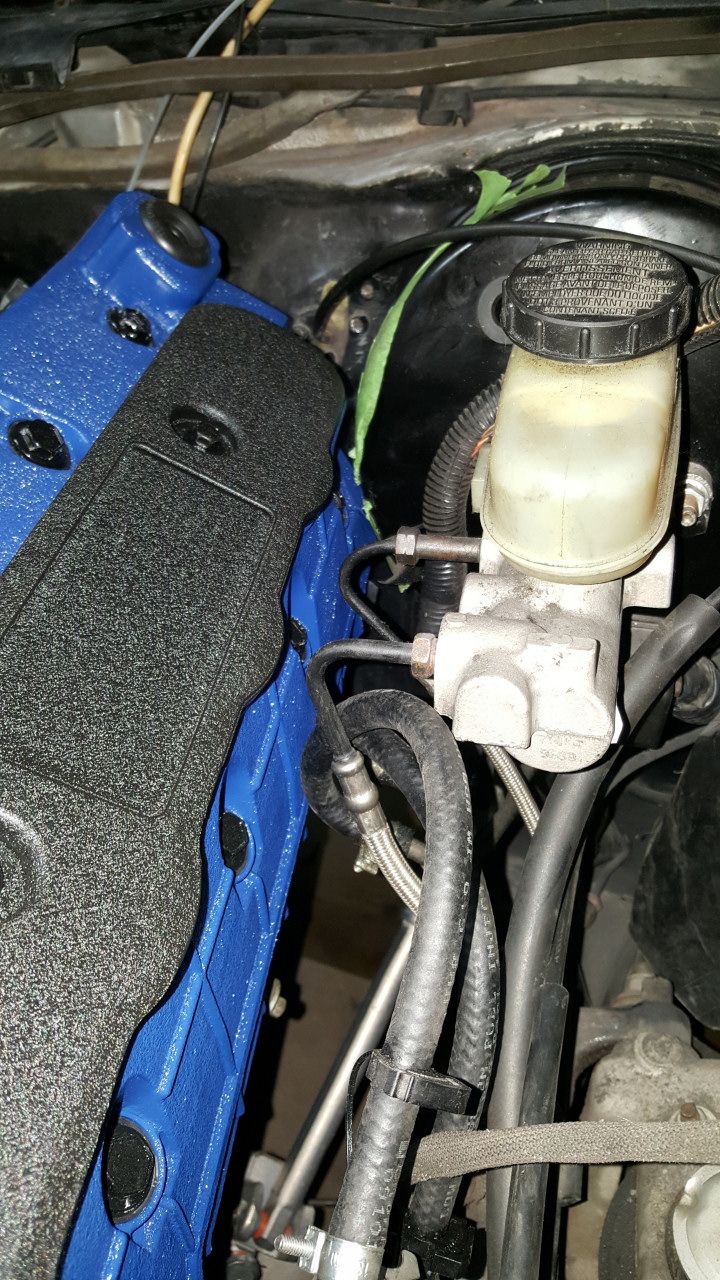 Brake master cylinder and booster assembly with blue painted component