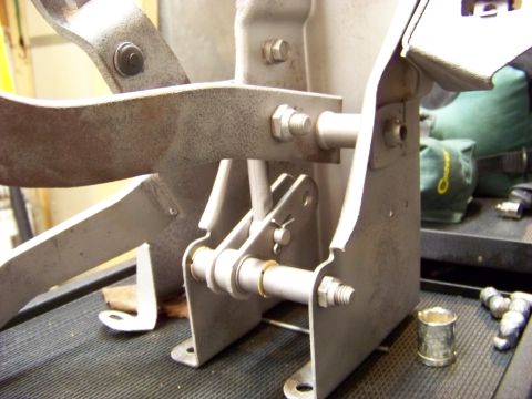 1974 Dodge Challenger - Close-up view of a vehicle's pedal assembly, showing mechanical linkages and mounting hardware.