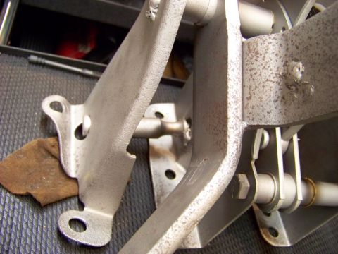 1974 Dodge Challenger - A close-up view of a vehicle's pedal assembly, showing the mechanical components and mounting hardware.