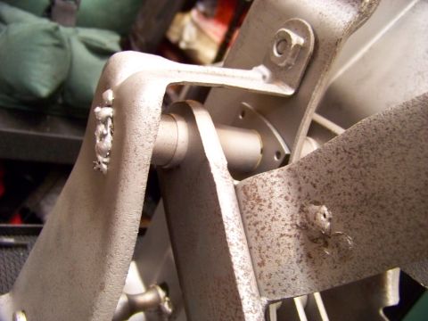 1974 Dodge Challenger - Metal bracket assembly with bolts and welds, likely a component from machinery.