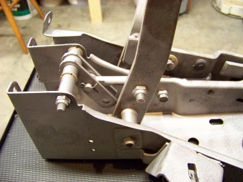 1974 Dodge Challenger - Metal pedal assembly with linkages and bolts, likely from a vehicle's interior.