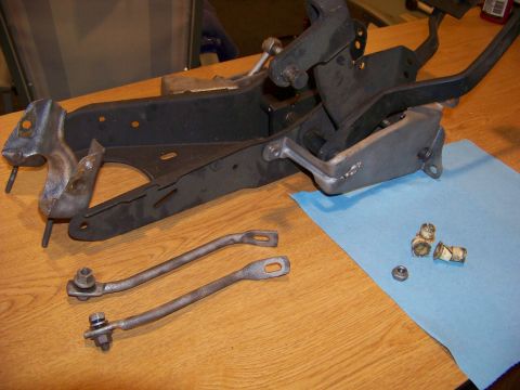 1974 Dodge Challenger - Disassembled pedal assembly and linkage components laid out on a table.