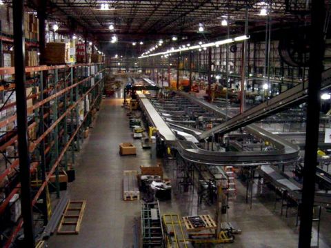 1979 Ford Bronco - Interior view of a large warehouse facility extensive shelving and conveyor systems.