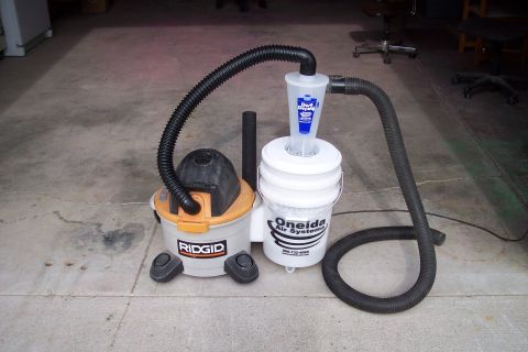 1990 Ford Bronco - A Rigid shop vacuum is connected to an Oneida Air Systems cyclone dust collector.