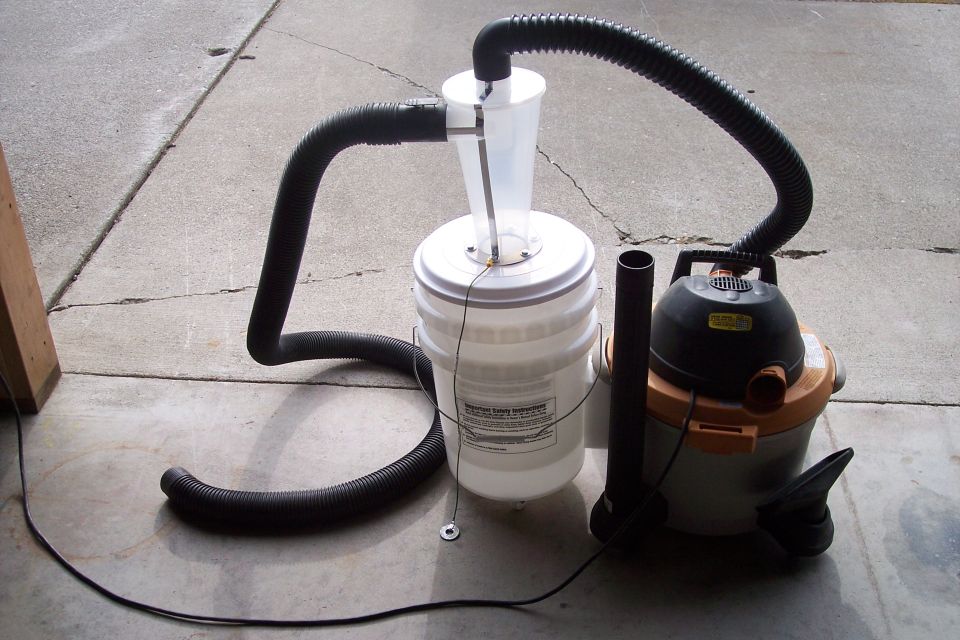 Shop vac connected to a 5-gallon bucket with a cyclone dust separator and hoses