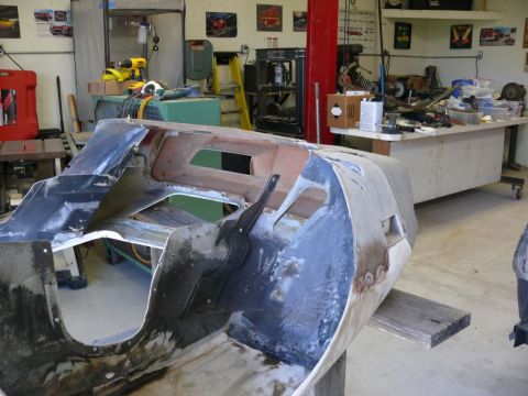 1976 Chevrolet Corvette front body section, disassembled, in a workshop