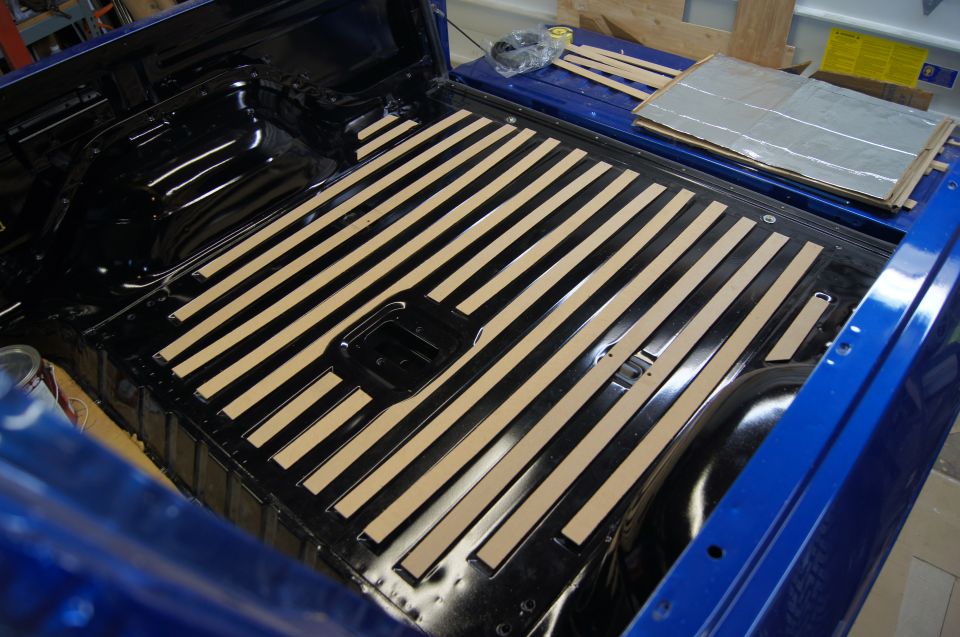 Cut strips of mdf to fill in the ridges in the bed. Similar to the factory strips but we cut them to fit much closer.
