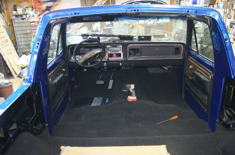 1979 Ford Bronco - Interior view of a 1979 Ford Bronco, showing the dashboard and carpet.