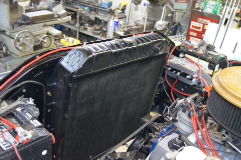 1979 Ford Bronco - Close-up view of a vehicle's engine bay, focusing on the radiator and associated components, with a SuperMotors watermark visible.