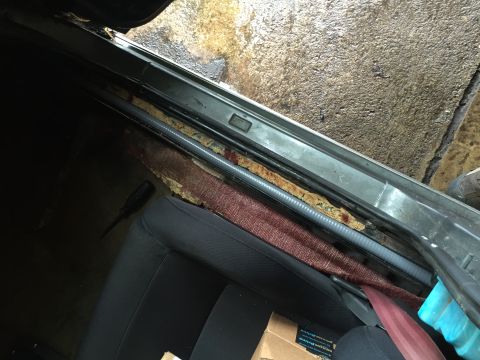 1981 Ford LTD - Flexible conduit running down channel by doors. Well protected.