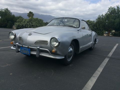 1968 Ford Mustang - This 1968 Volkswagen Karmann Ghia is parked outdoors under a cloudy sky.