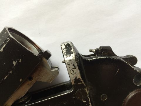 1987 Ford Bronco - Two metal components are shown in detail, one a circular stamp.