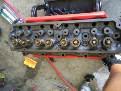 1987 Ford Bronco - This engine part shows valve springs and retainers, likely during a rebuild or maintenance.