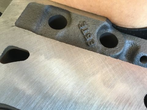 1987 Ford Bronco - Close-up of an engine component showing the 'E3TE' casting and machined surfaces.