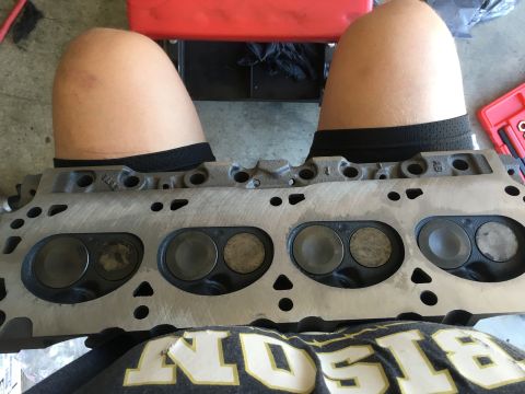 1987 Ford Bronco - Close-up of an engine cylinder head with visible valves and ports.