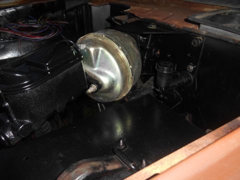 1972 Ford Bronco - Close-up of a brake booster and master cylinder assembly.