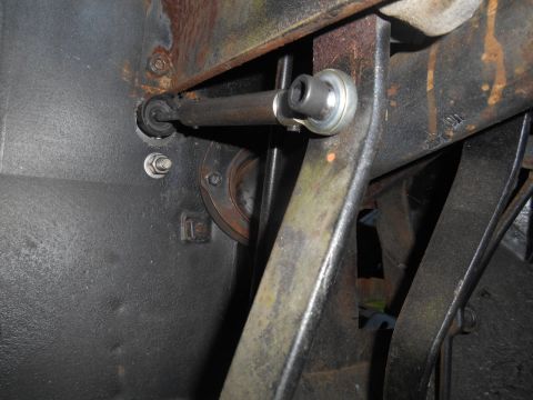 1972 Ford Bronco - Close-up of vehicle steering linkage showing a rod and ball joint assembly.