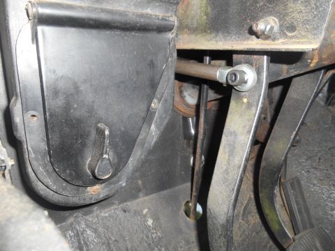 1972 Ford Bronco - Interior view of the pedal assembly and linkage mechanism within a vehicle.