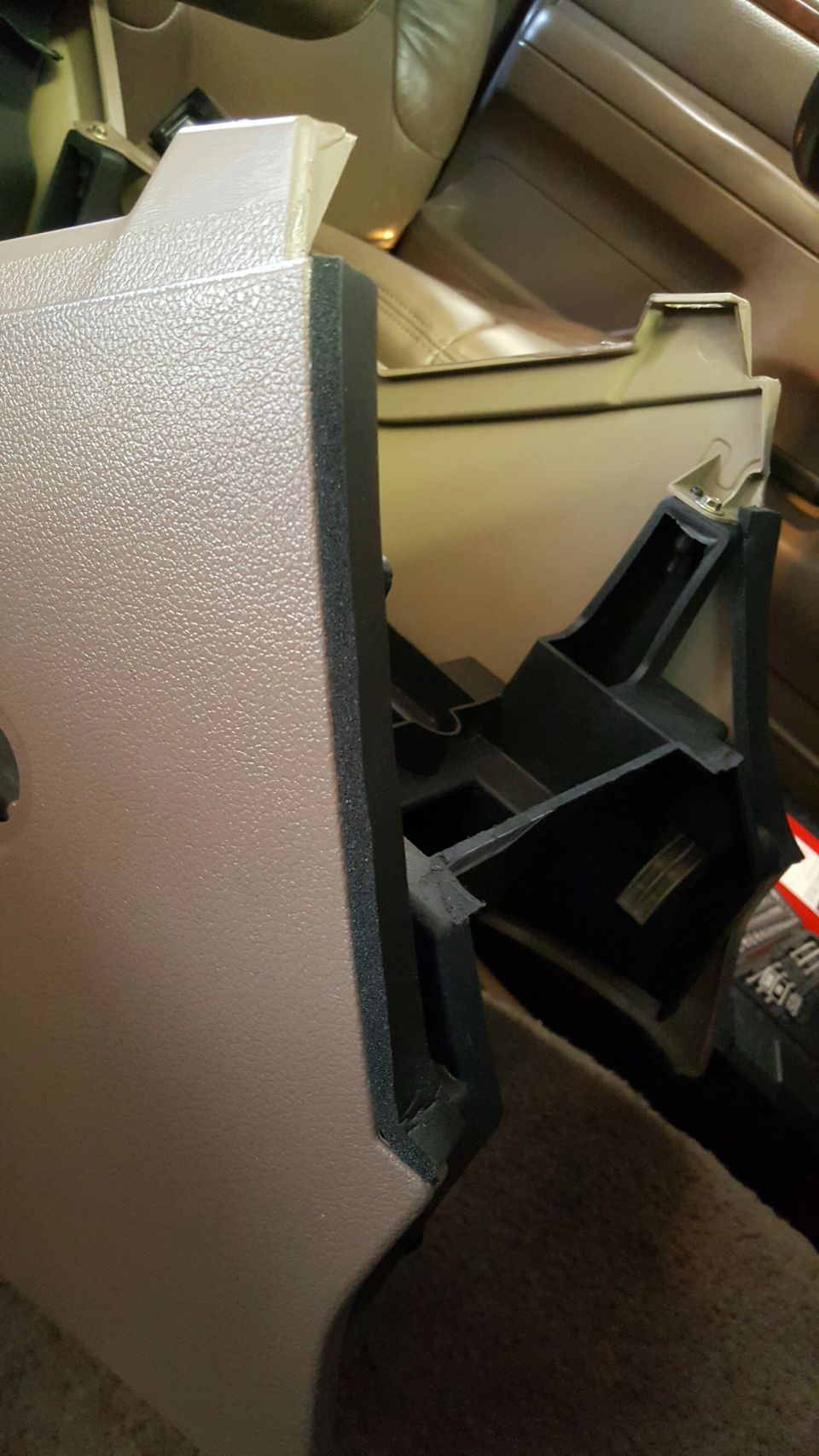 Interior center console plastic trim piece removed from vehicle