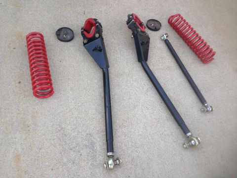 1979 Ford Bronco - This image displays a set of aftermarket suspension components, including control arms and coil springs.