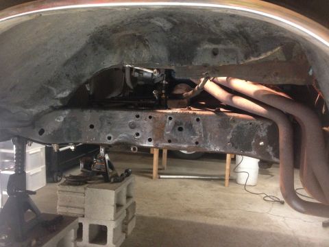 1979 Ford Bronco - Close-up view of a vehicle's undercarriage, focusing on the frame and exhaust system.