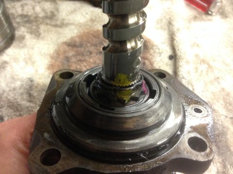 1979 Ford Bronco - Mechanical part with a splined shaft and visible gear teeth, likely undergoing repair or inspection.