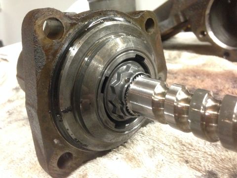 1979 Ford Bronco - This image shows a close-up of a vehicle's steering gear component, likely a sector shaft, with visible splines and internal gearing.