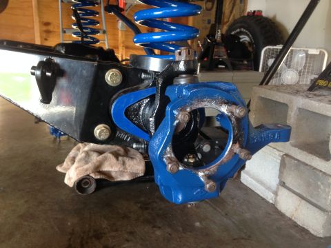 1979 Ford Bronco - Vehicle suspension part, likely a knuckle or spindle, painted bright blue.