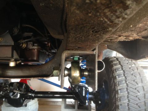1979 Ford Bronco - The photo shows a close-up view of the suspension system on a vehicle's undercarriage.