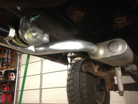 1979 Ford Bronco - Underside view of a vehicle's exhaust system, including the muffler and piping.
