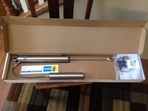 1979 Ford Bronco - A pair of new Bilstein shock absorbers are shown in their original packaging with included hardware.
