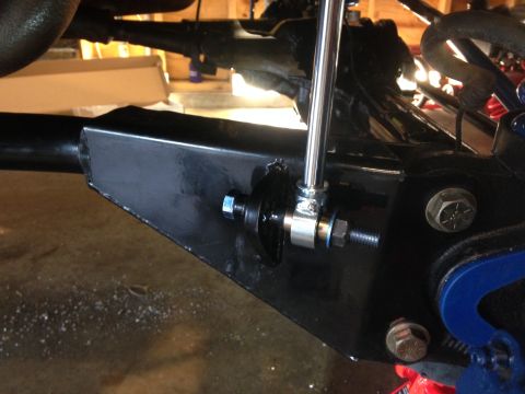 1979 Ford Bronco - Close-up view of a vehicle's suspension component, showing a shiny rod and hardware.