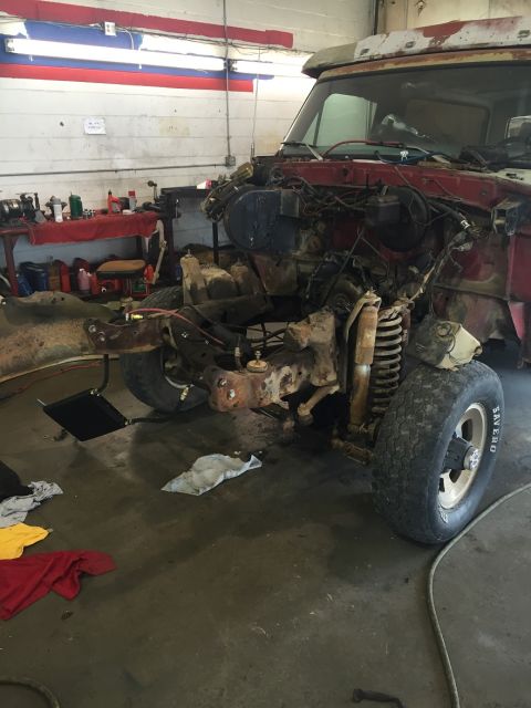 1978 Ford Bronco - This vehicle is in a state of disassembly, with its front end components exposed and removed.
