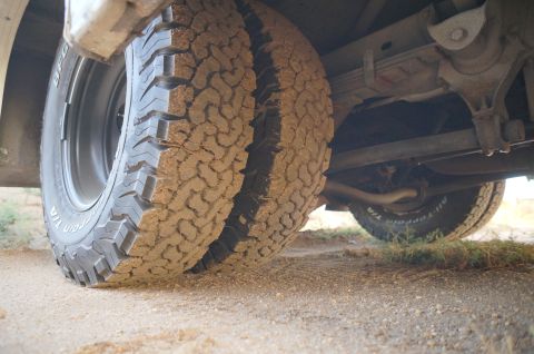 1995 Chevrolet P30 1 Ton - Step Van - Close-up view of the rear dual wheels and suspension system of a vehicle.