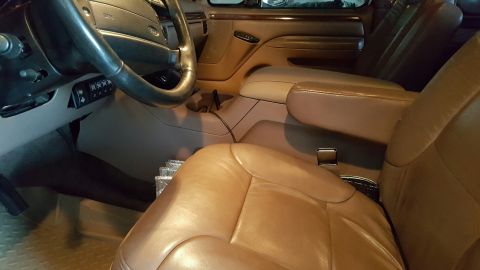 1996 Ford Bronco - Interior view of a 1996 Ford Bronco, focusing on the center console and front seats.