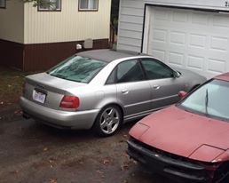 2001 Audi S4 - Silver 2001 Audi S4 sedan parked next to a red car.