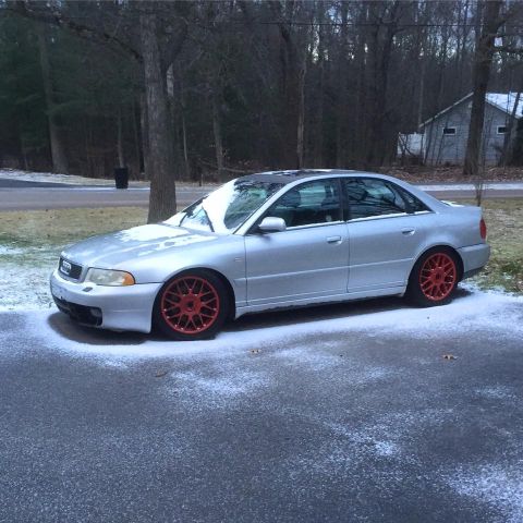 2001 Audi S4 - Silver 2001 Audi S4 sedan with red wheels parked on a snowy driveway.