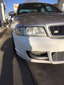 2001 Audi S4 - Front view of a silver 2001 Audi S4 with an exposed intercooler, parked at a gas station.