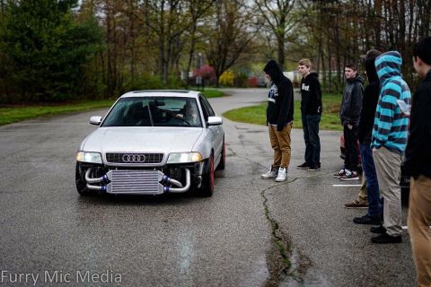 2001 Audi S4 - Modified 2001 Audi S4 with a prominent front-mounted intercooler is the focus of a group of onlookers.