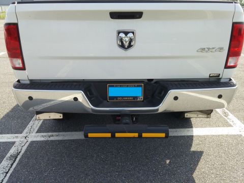 2000 Ford Crown Victoria - Rear view of a white pickup truck, showing the bumper, taillights, and license plate.