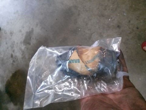 1996 Ford Bronco - A ball joint part is shown in its original plastic packaging, with some text visible on the label.