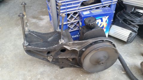 1992 Ford Bronco - Power steering pump assembly with pulley and mounting bracket, likely from a Ford vehicle.