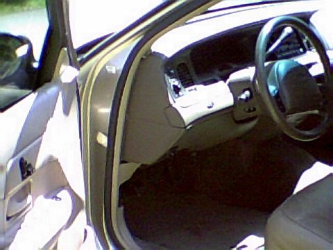 1999 Ford Crown Victoria - Interior view of a 1998 Ford Crown Victoria, showing the dashboard and steering wheel.