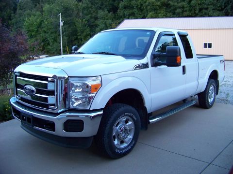 2011 Ford F-250 - Front 3/4 view of a white 2011 Ford F-250 pickup truck.